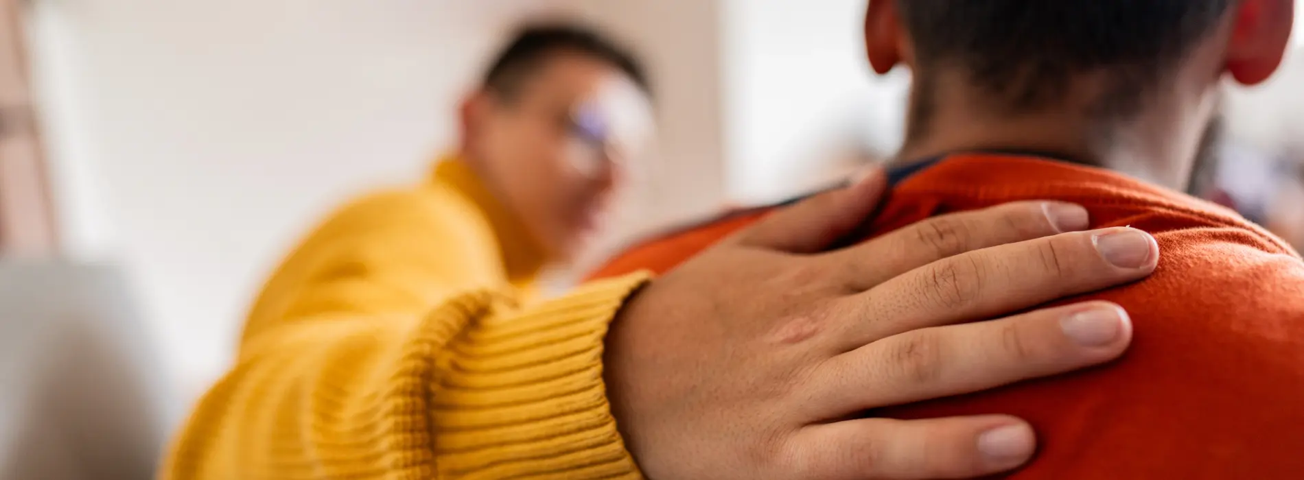 counselor hand on back of patient