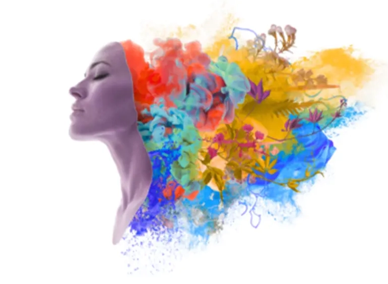 a woman head is exploding with color
